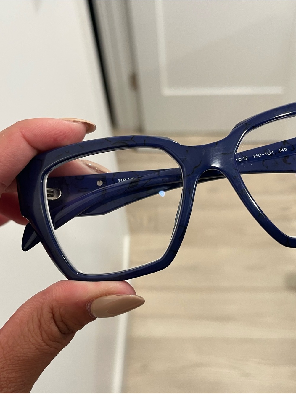 Navy blue Prada eyeglasses marble pattern